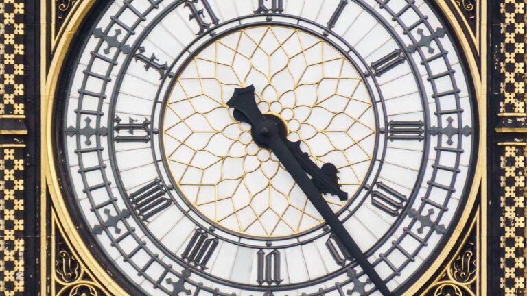 Landscape detail of the Elizabeth Tower clock face and hands in a2014 archive photograph