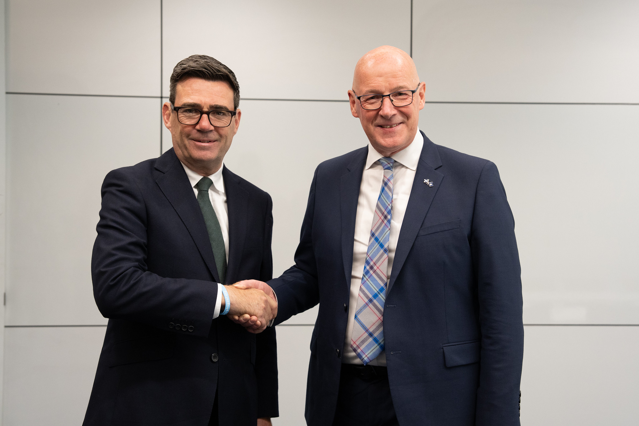 Andy Burnham and John Swinney shake hands in Glasgow in July 2026