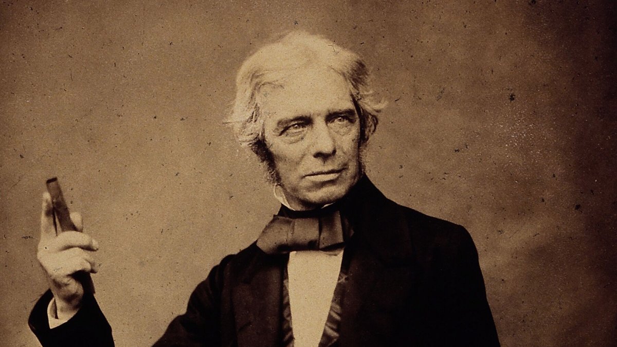 Michael Faraday in a historical photograph by Maull and Polyblank, full head and raised hand intact