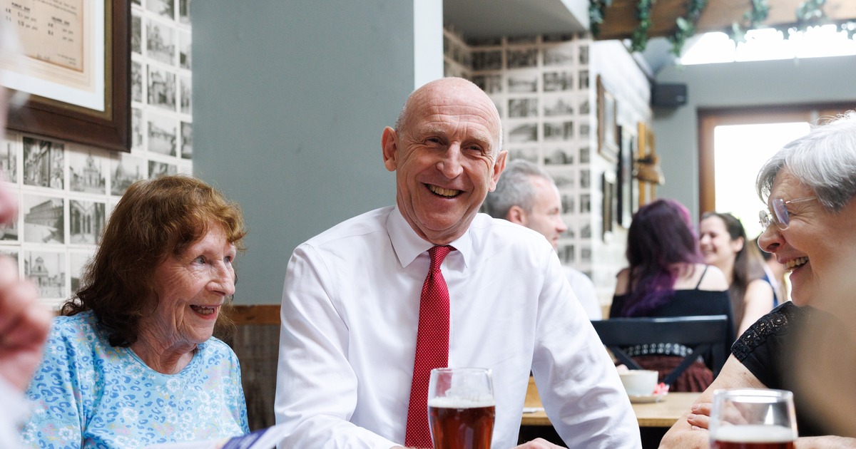Business rates: Chancellor John Healey laughing with customers at the Hare pub in Harlow
