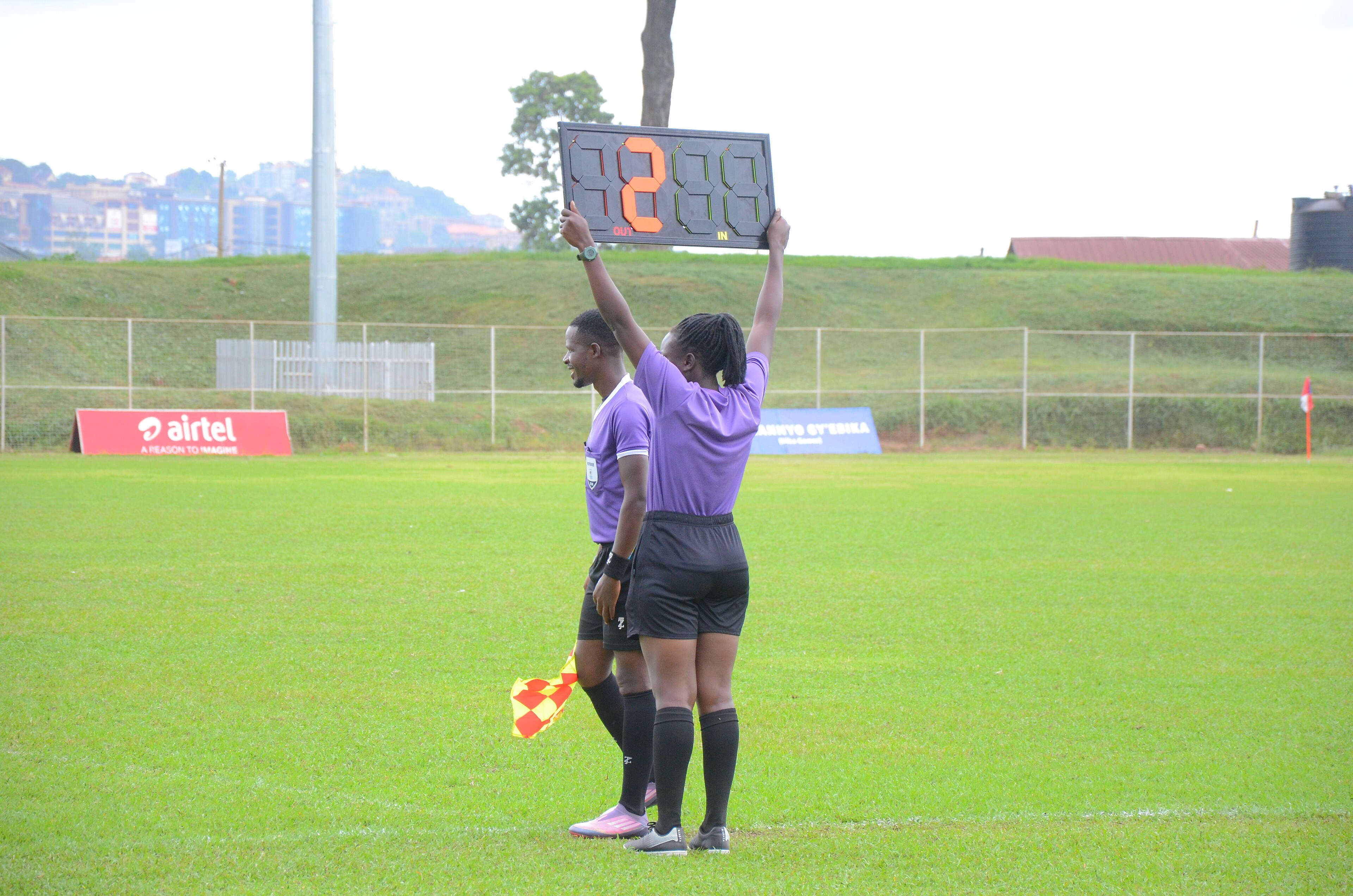 A match official holds up a substitution board, as used for concussion substitutions